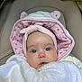 baby, infant, blanket, hood, pink, white, ears, clothing, face, portrait, cute, child, person, newborn, soft, warm, closeup, expression, indoors, seated