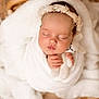adorable, baby, blanket, child, cozy, cuddly, cute, face, flower, hand, headband, infant, knitted_toy, newborn, peaceful, portrait, sleeping, soft_texture, white, wrapped