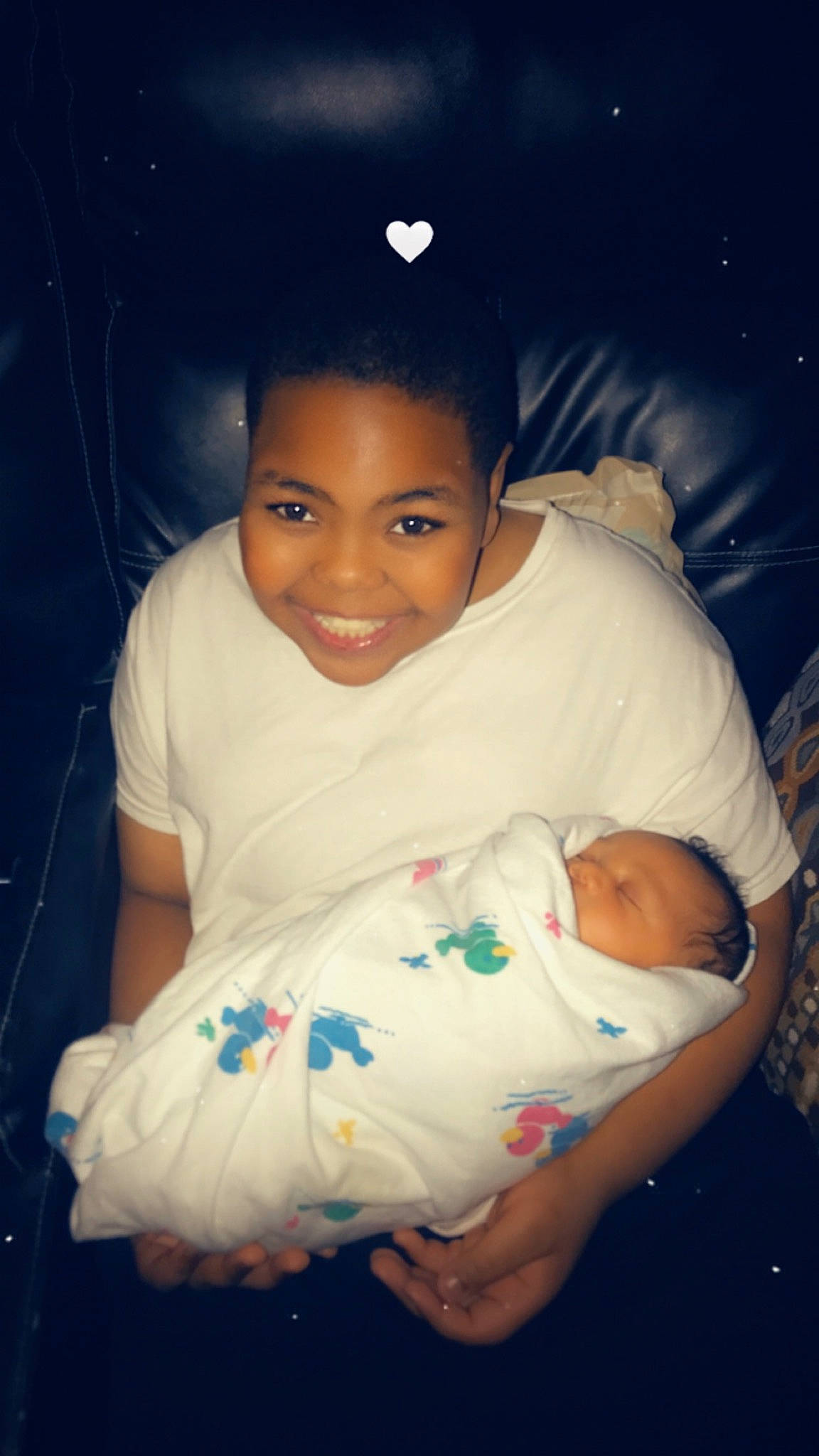 Trenton is registered to the contest to win money with this photo: abdomen, baby, baby_toddler_clothing, cheek, child, chin, comfort, elbow, eye, flash_photography, fun, happy, human_body, iris, joy, lap, person, sitting, skin, smile