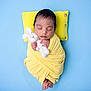 Aarav joined the competition — help win amazing prizes! newborn, baby, sleeping, yellow_blanket, yellow_pillow, blue_background, soft_toy, knitted_bunny, swaddled, infant, peaceful, portrait, cute, tiny_hands, tiny_feet, resting, indoors, closeup, child, adorable