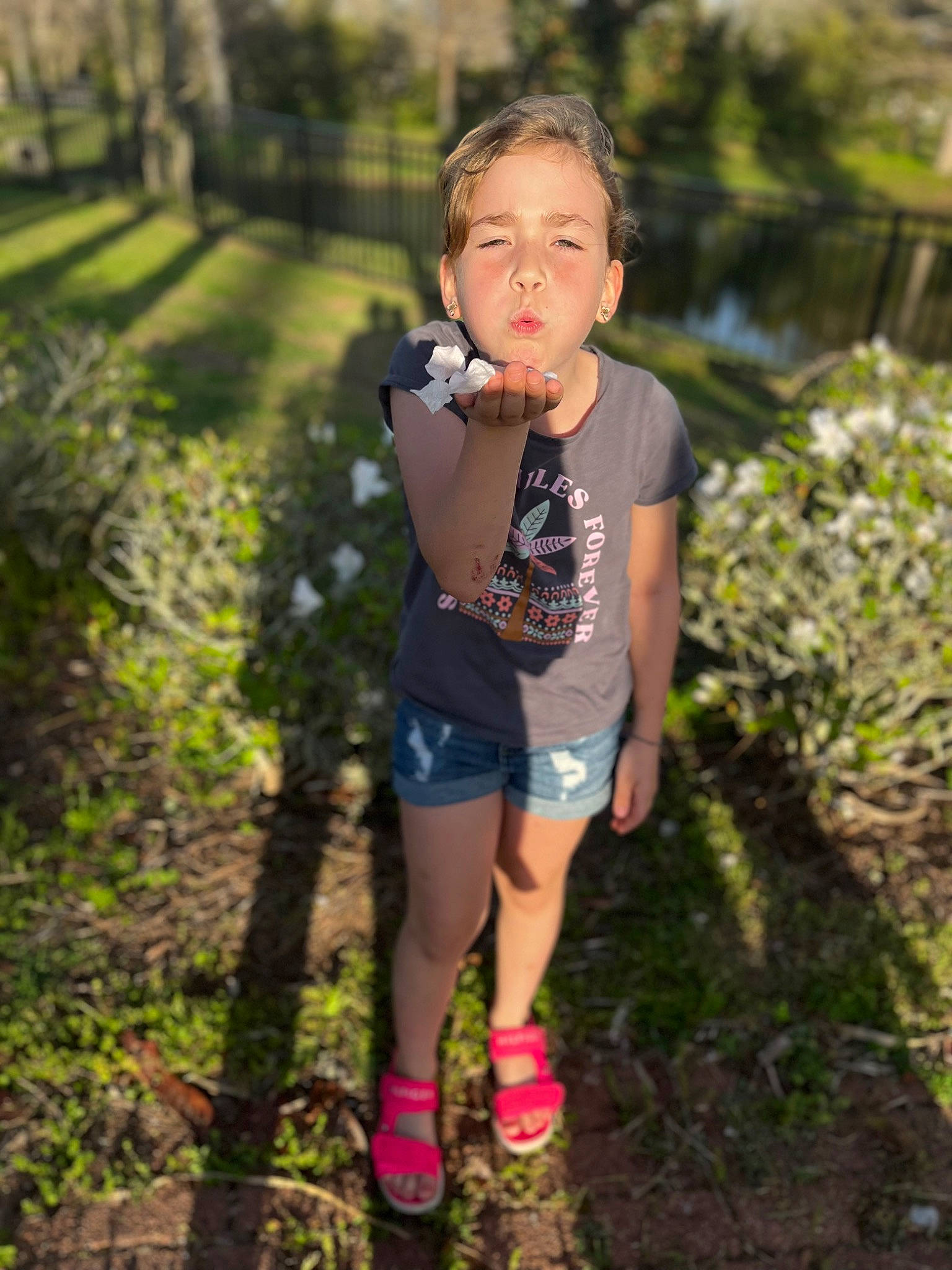Emma is registered to the contest to win money with this photo: beauty, child, flash_photography, fun, grass, happy, landscape, leaf, leg, leisure, natural_environment, people_in_nature, person, plant, running, shorts, sneakers, sunlight, t_shirt, tree