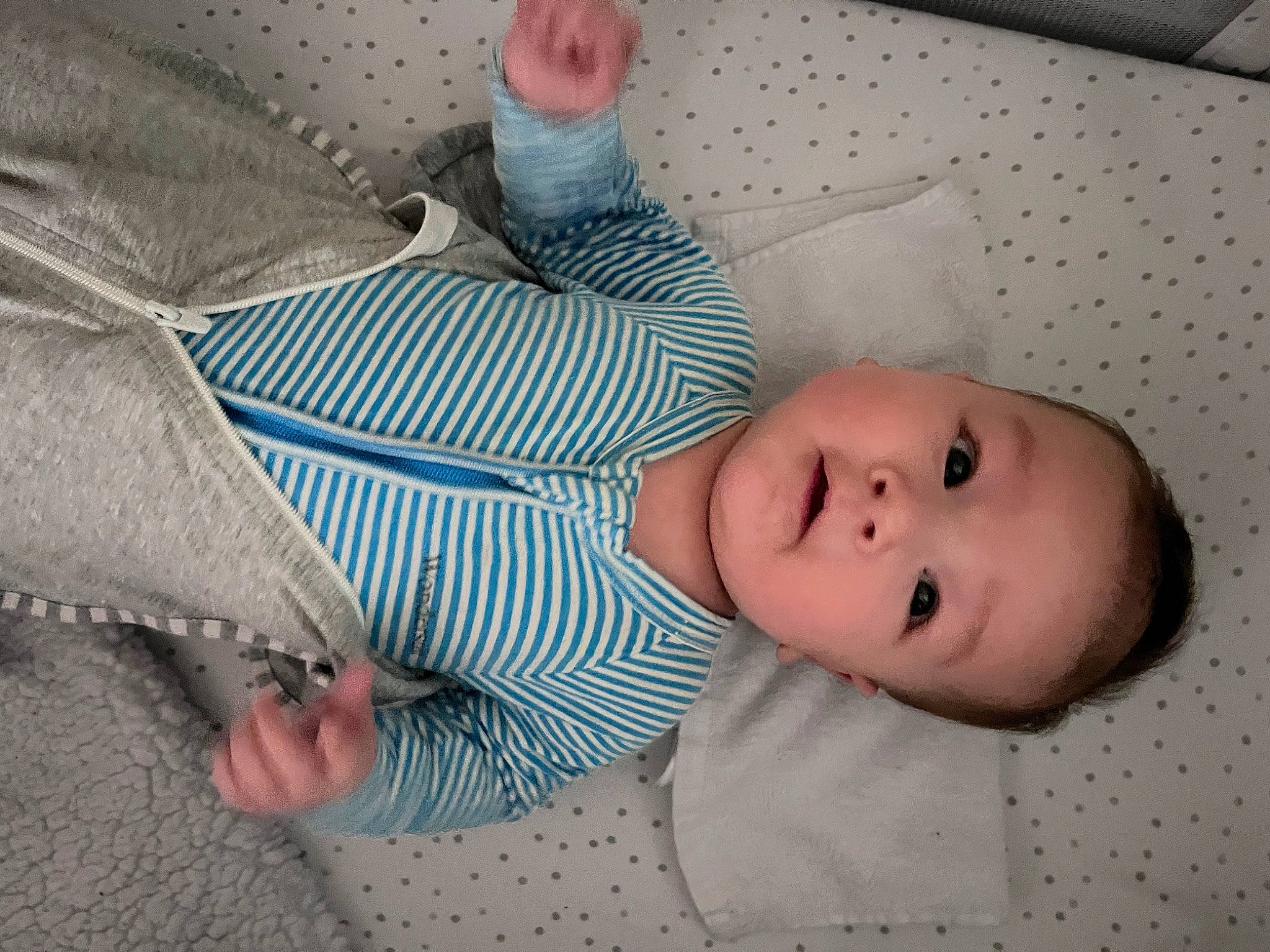 Colton is registered to the contest to win money with this photo: baby, baby_products, baby_safety, baby_toddler_clothing, bedding, cheek, child, comfort, facial_expression, finger, gesture, linens, mouth, nap, nose, pattern, person, room, skin, sleeve