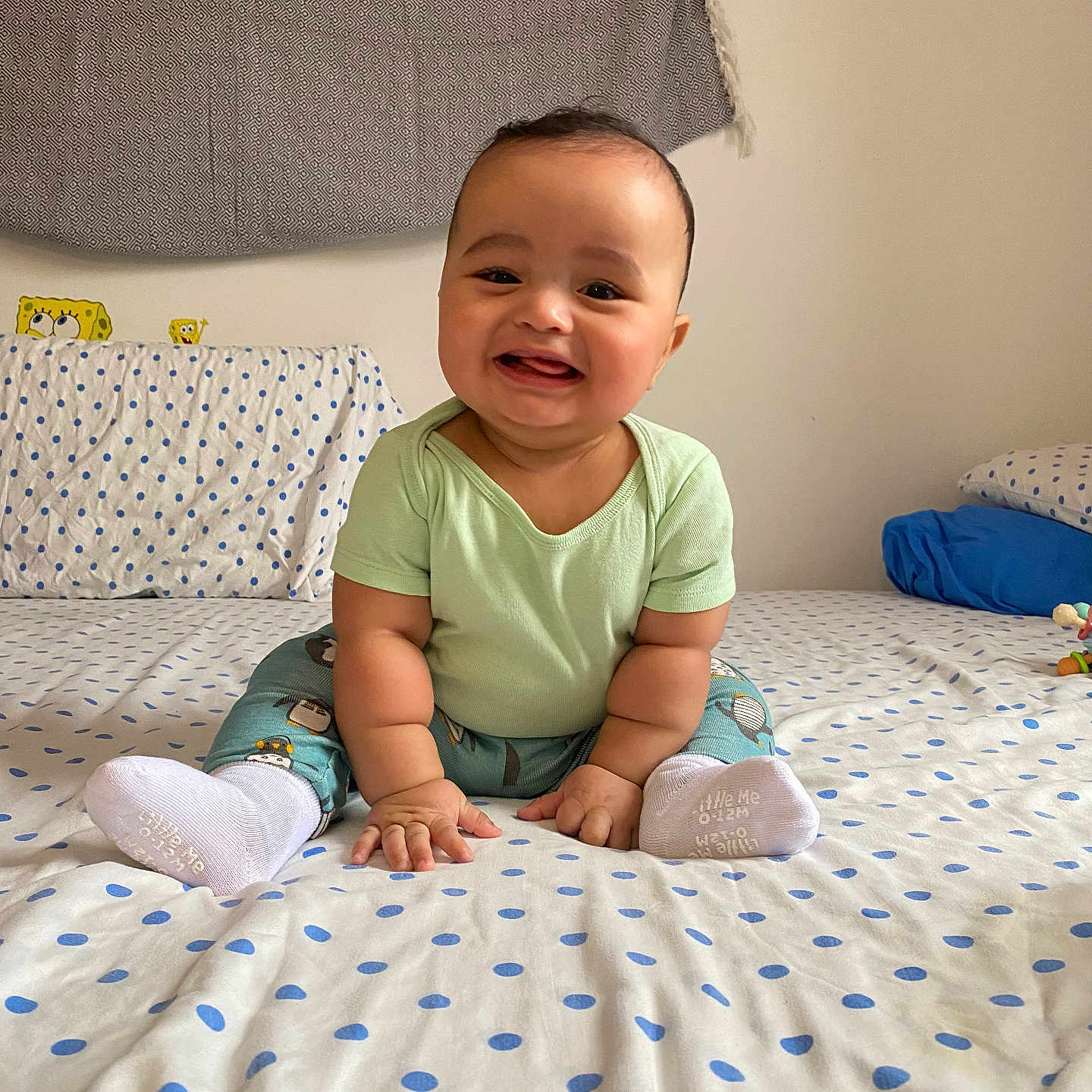 Azaan joined the competition — help win amazing prizes! baby, babylaughing, bed, bedroom, clothing, cushion, face, furniture, happy, head, homedecor, hosiery, indoors, person, photography, portrait, room, sitting, smile, sock