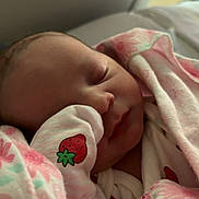 Malayah joined the competition — help win amazing prizes! newborn, baby, sleeping, blanket, mitten, strawberry, pink, floral, infant, cute, peaceful, face, closeup, soft, resting, indoors, child, wrapped, toddler, portrait