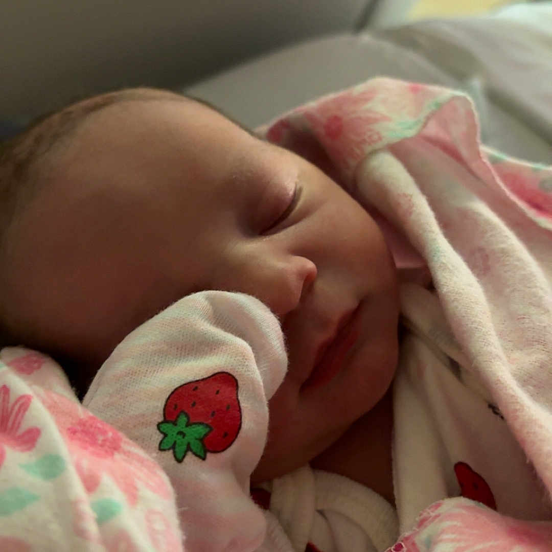 Malayah joined the competition — help win amazing prizes! newborn, baby, sleeping, blanket, mitten, strawberry, pink, floral, infant, cute, peaceful, face, closeup, soft, resting, indoors, child, wrapped, toddler, portrait