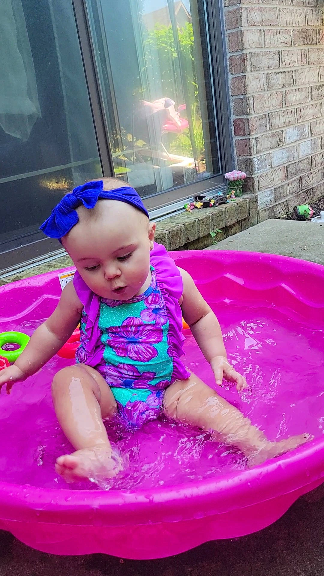 Gemma joined the competition — help win amazing prizes! baby, baby_toddler_clothing, bathing, child, electric_blue, fun, green, happy, hat, leisure, magenta, pattern, person, pink, plant, purple, recreation, sitting, toddler, water