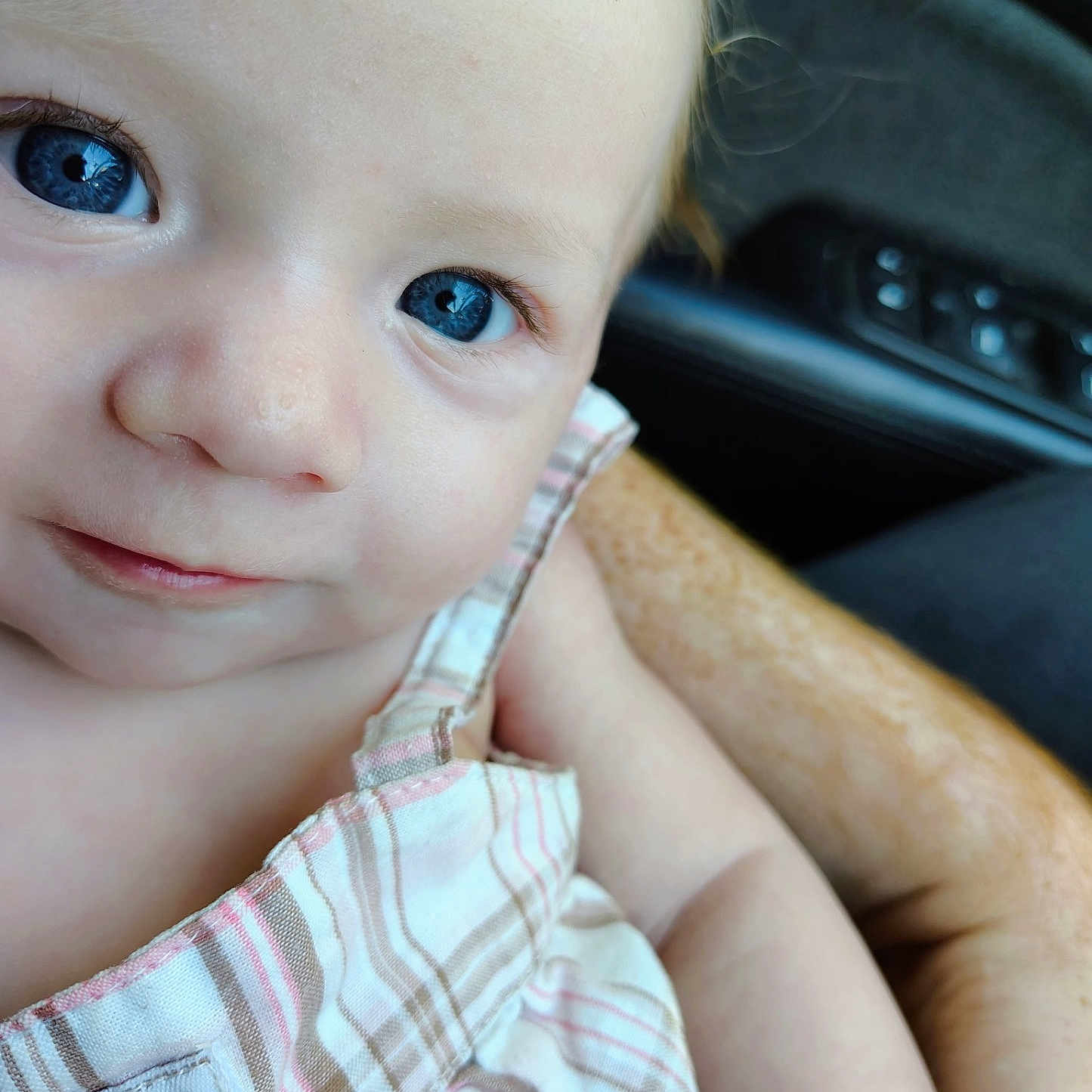 Tellisa joined the competition — help win amazing prizes! arm, baby, blue_eyes, calvin_klein, child, close_up, cute, eyelashes, face, freckles, holding, human, indoor, infant, person, portrait, skin, smile, soft_light, striped_clothing