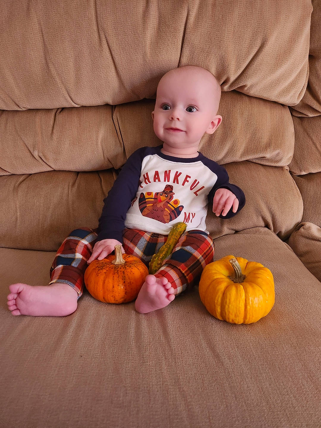 John joined the competition — help win amazing prizes! baby_toddler_clothing, calabaza, comfort, cucurbita, eye, face, finger, flooring, gourd, head, human_body, joy, leg, orange, person, plant, pumpkin, smile, squash, vegetable