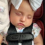 Lilyanah Andre is registered to the contest to win money with this photo: baby, sleeping, car_seat, bow, headwear, blanket, child, infant, safety_harness, cute, peaceful, soft_lighting, closeup, indoors, clothing, patterned_fabric, face, portrait, relaxation, nap