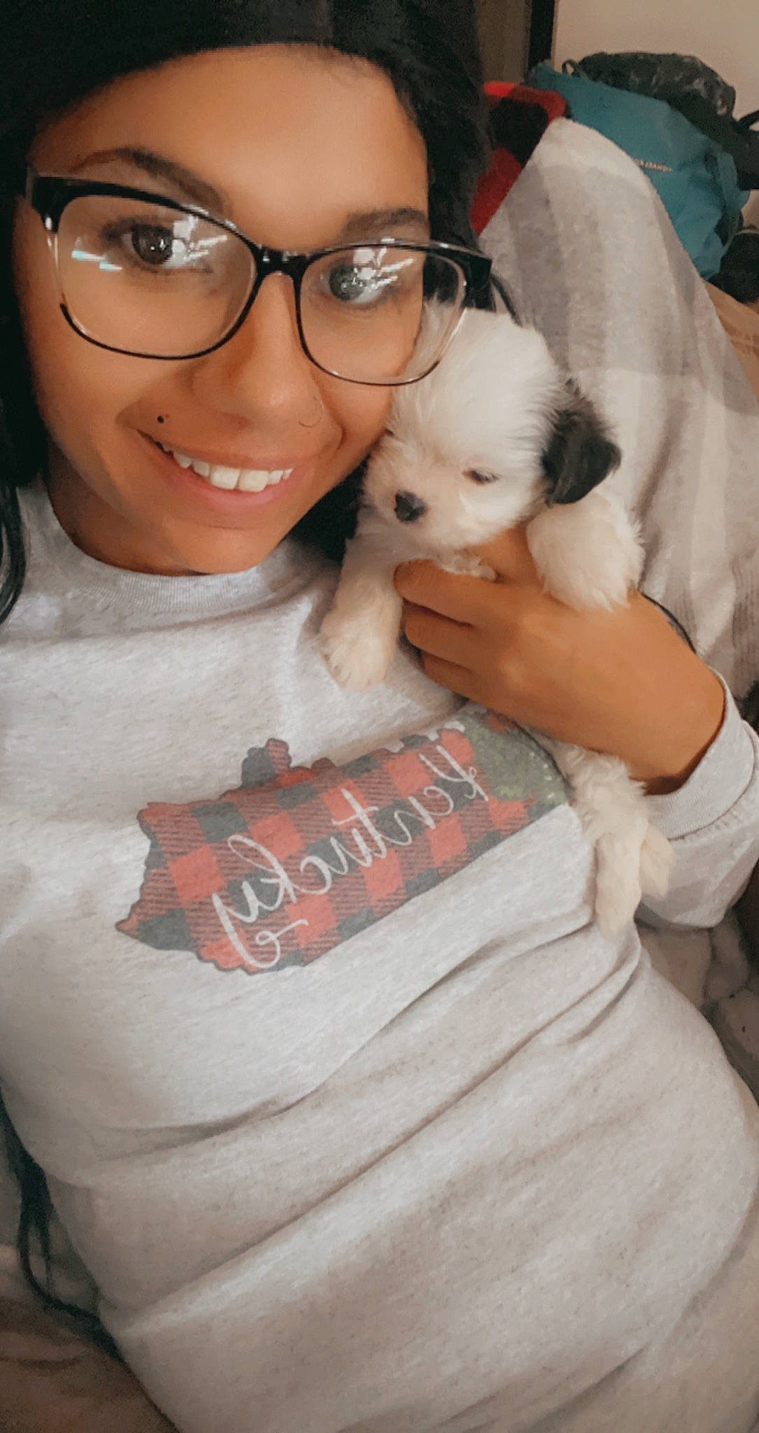 Zoe is registered to the contest to win money with this photo: carnivore, comfort, companion_dog, dog, dog_breed, ear, eyewear, fawn, fun, gesture, glasses, happy, nose, skin, sleeve, smile, t_shirt, toy_dog, vision_care, white