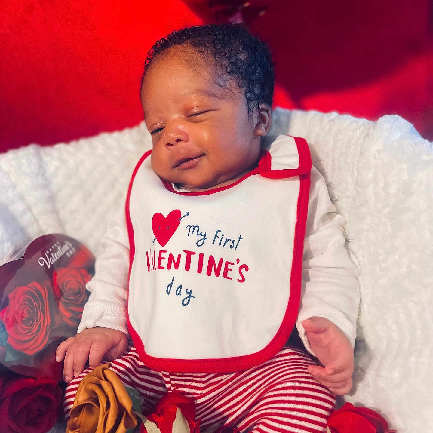 Reign Supreme is registered to the contest to win money with this photo: baby, blanket, clothing, couch, cushion, face, flower, flowerarrangement, flowerbouquet, furniture, glove, head, homedecor, newborn, person, photography, plant, portrait, rose, sleeping