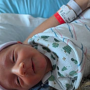 Finnick joined the competition — help win amazing prizes! baby, bed, blanket, blue, closeup, comfort, cozy, face, hat, hospital, infant, newborn, pattern, portrait, resting, skin, sleepy, soft, striped, wristband