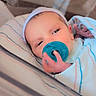 Finnick joined the competition — help win amazing prizes! baby, bed, blanket, blue, closeup, cute, face, hand, headwear, hospital, hospital_bassinet, infant, newborn, pacifier, person, resting, sleepy, small, striped, swaddled