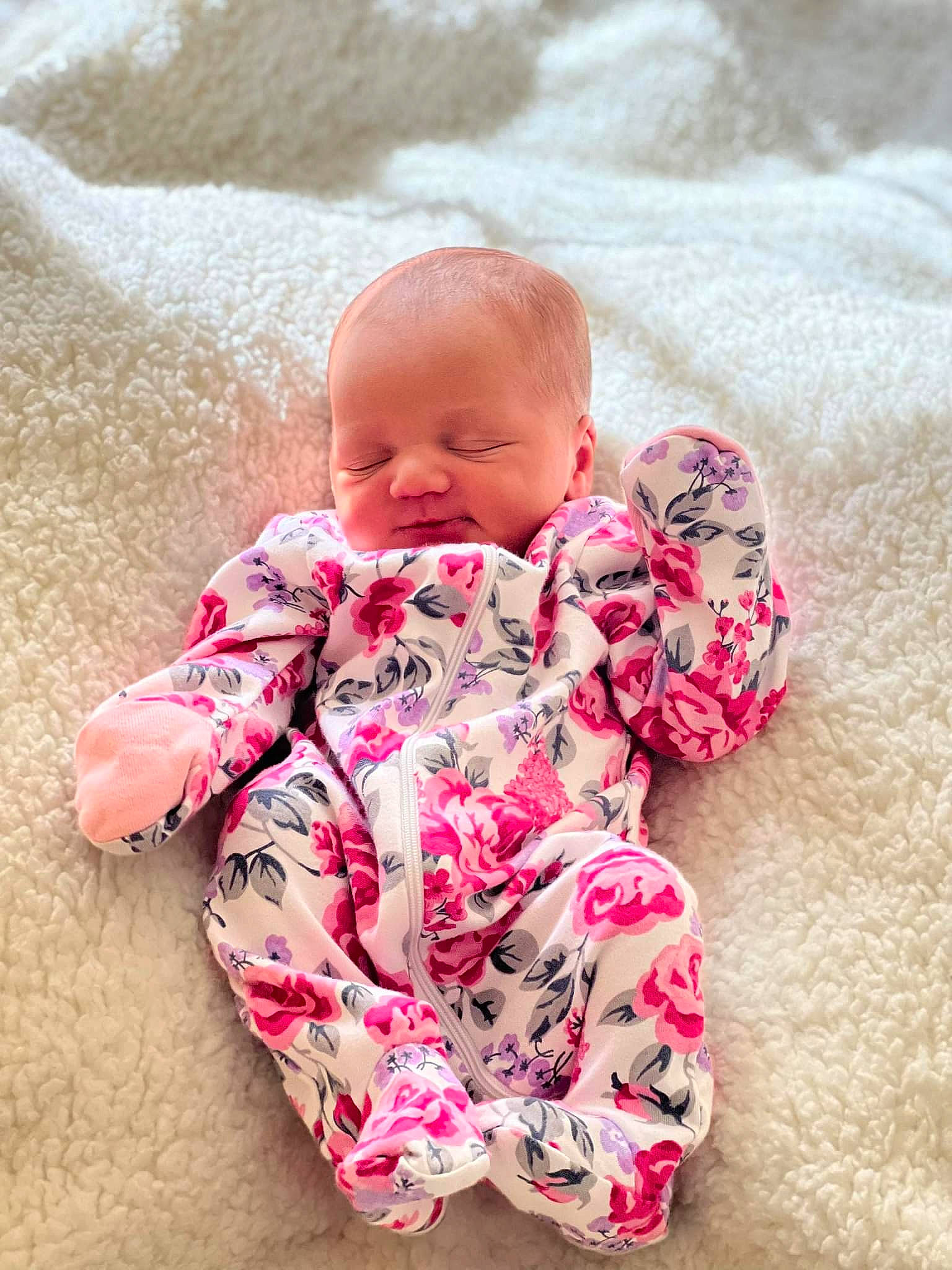 Rilynne is registered to the contest to win money with this photo: baby, baby_toddler_clothing, cheek, child, comfort, eye, face, foot, happy, head, human_body, human_leg, linens, pattern, person, pink, product, skin, sleeve, thigh