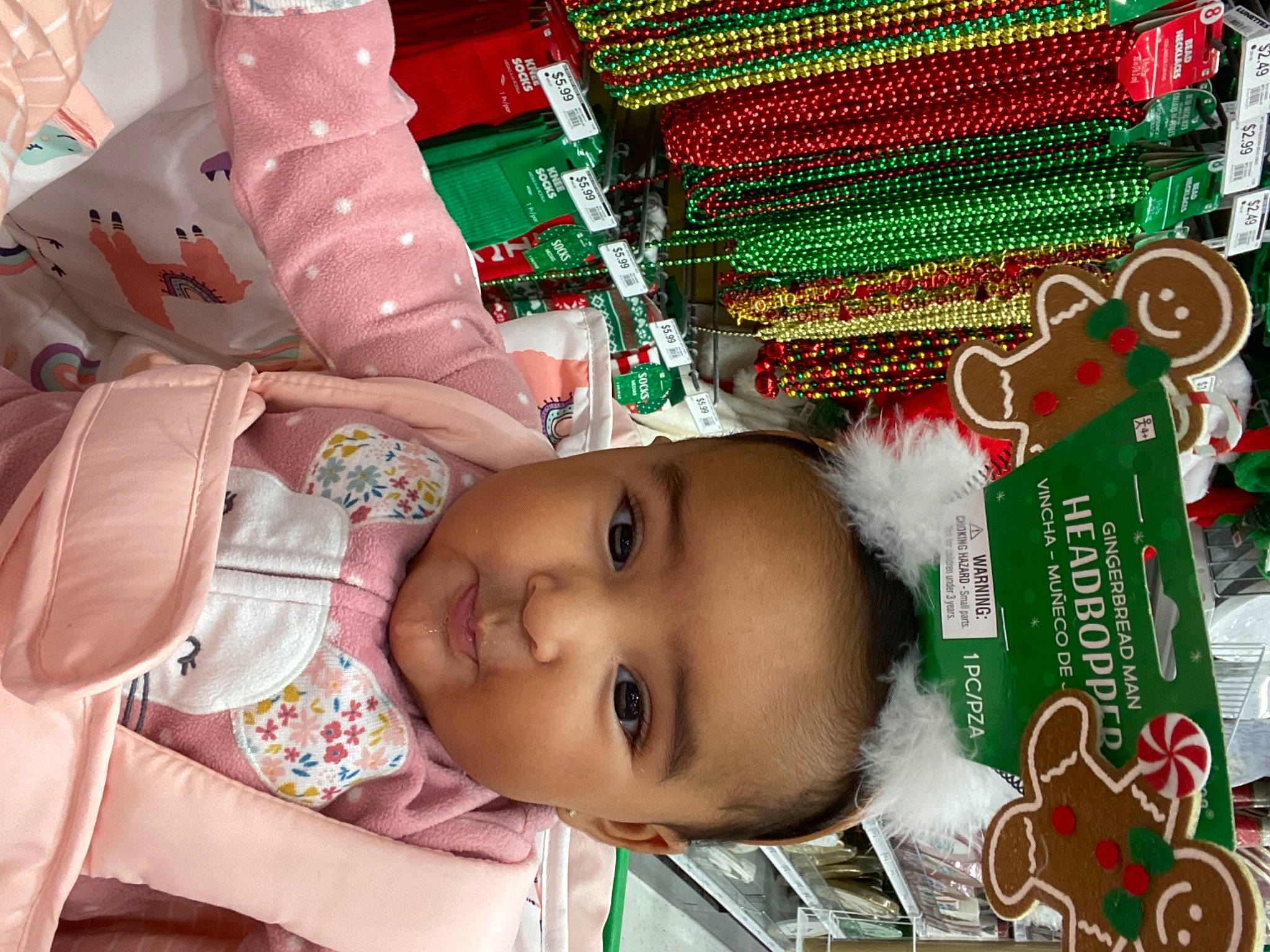Avalyn is registered to the contest to win money with this photo: baby, baby_toddler_clothing, christmas, christmas_decoration, christmas_eve, christmas_ornament, craft, creative_arts, green, holiday, needlework, ornament, peach, person, pink, stuffed_toy, textile, toddler