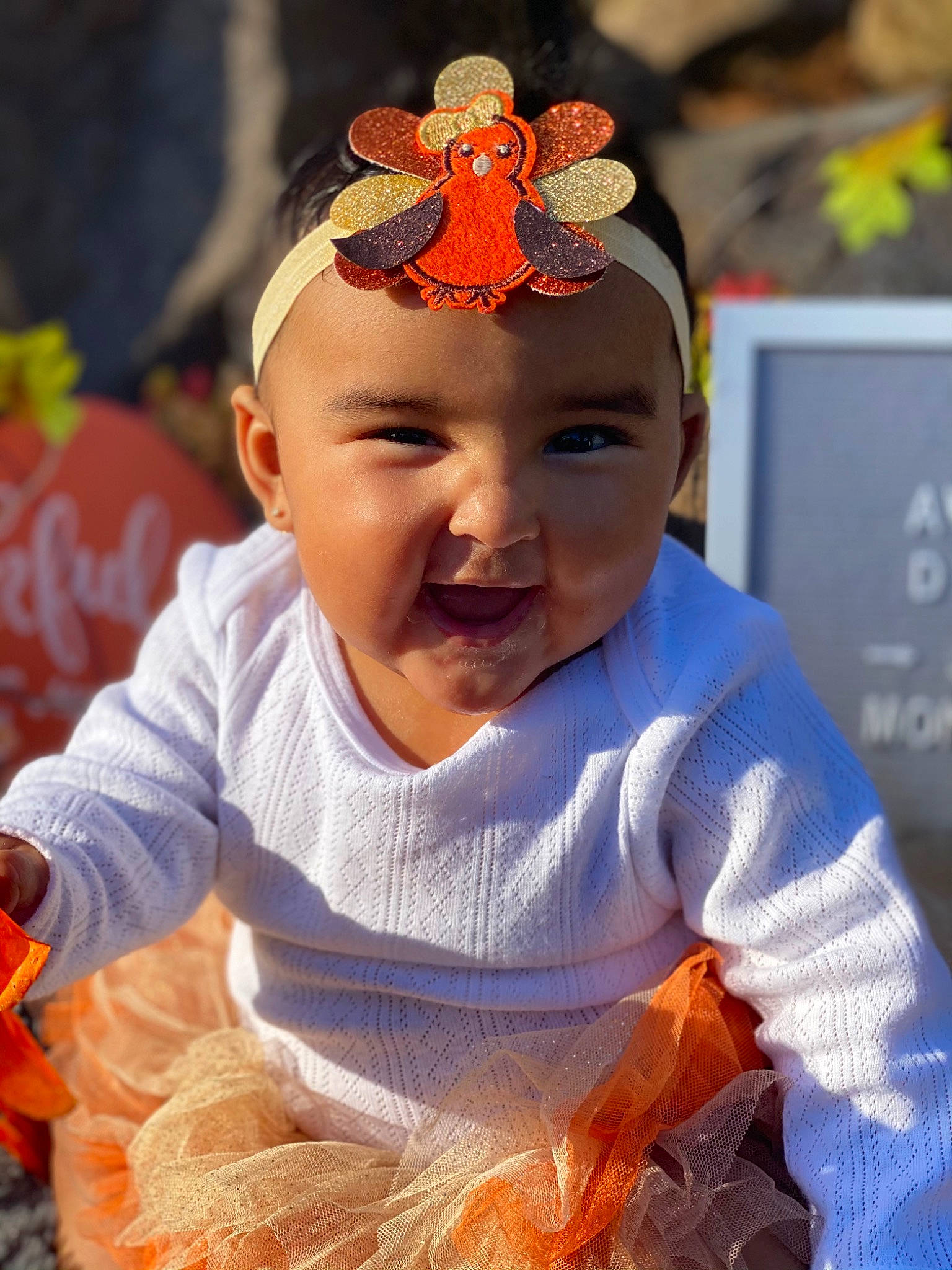 Avalyn is registered to the contest to win money with this photo: baby, baby_toddler_clothing, child, costume, costume_accessory, hair_accessory, headband, headgear, headpiece, headwear, orange, person, toddler