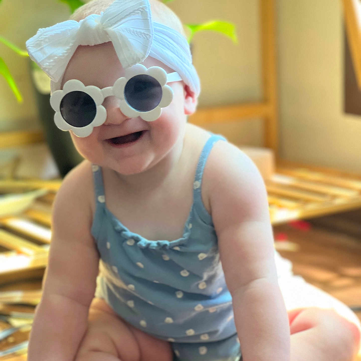 Annora joined the competition — help win amazing prizes! accessory, baby, baby_fashion, blue_outfit, bow, child, cute, fashion, happy, headband, indoor, infant, plant, polka_dots, portrait, sitting, smile, sunglasses, sunlight, wooden_floor