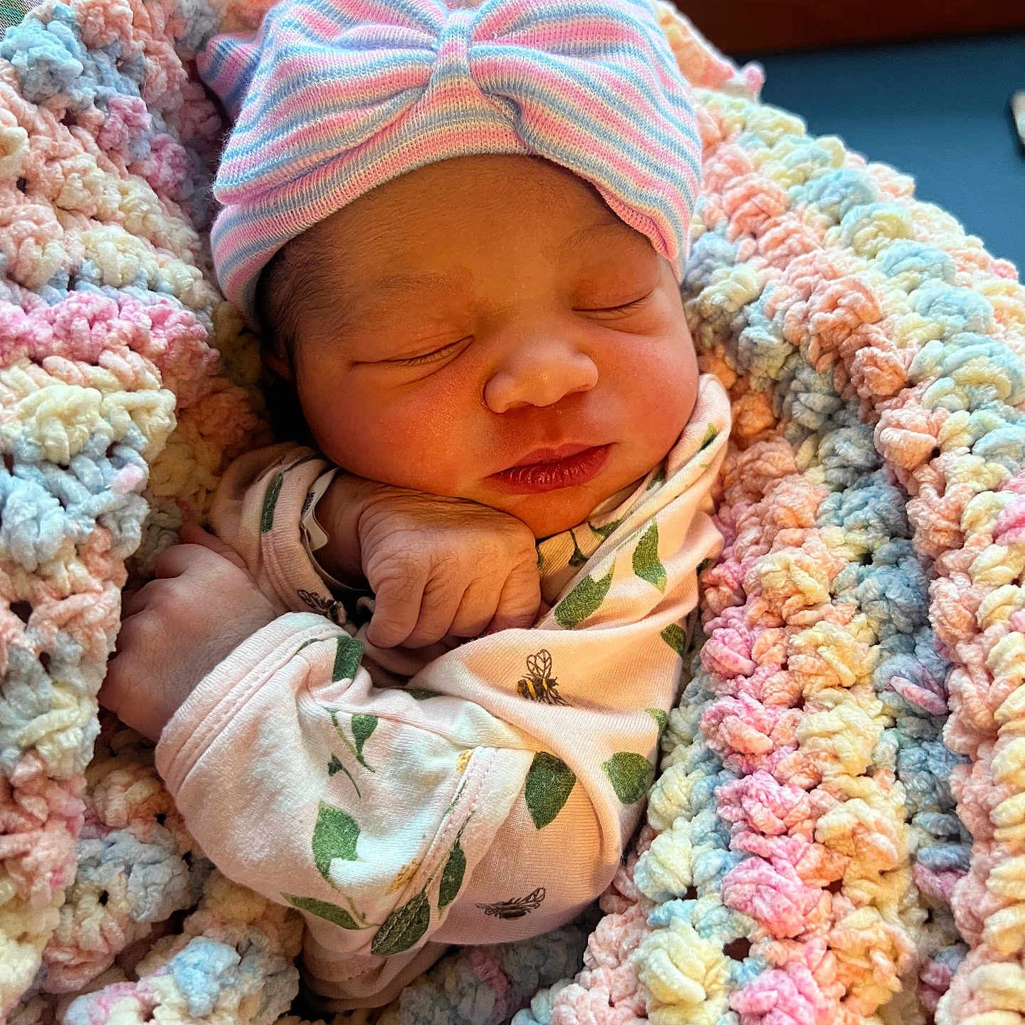 Kaliya is registered to the contest to win money with this photo: baby, blanket, bow, clothing, crochet, cute, face, hat, indoors, infant, newborn, pastel_colors, peaceful, person, portrait, sleep, sleeping, soft, tiny_hand, wrapped