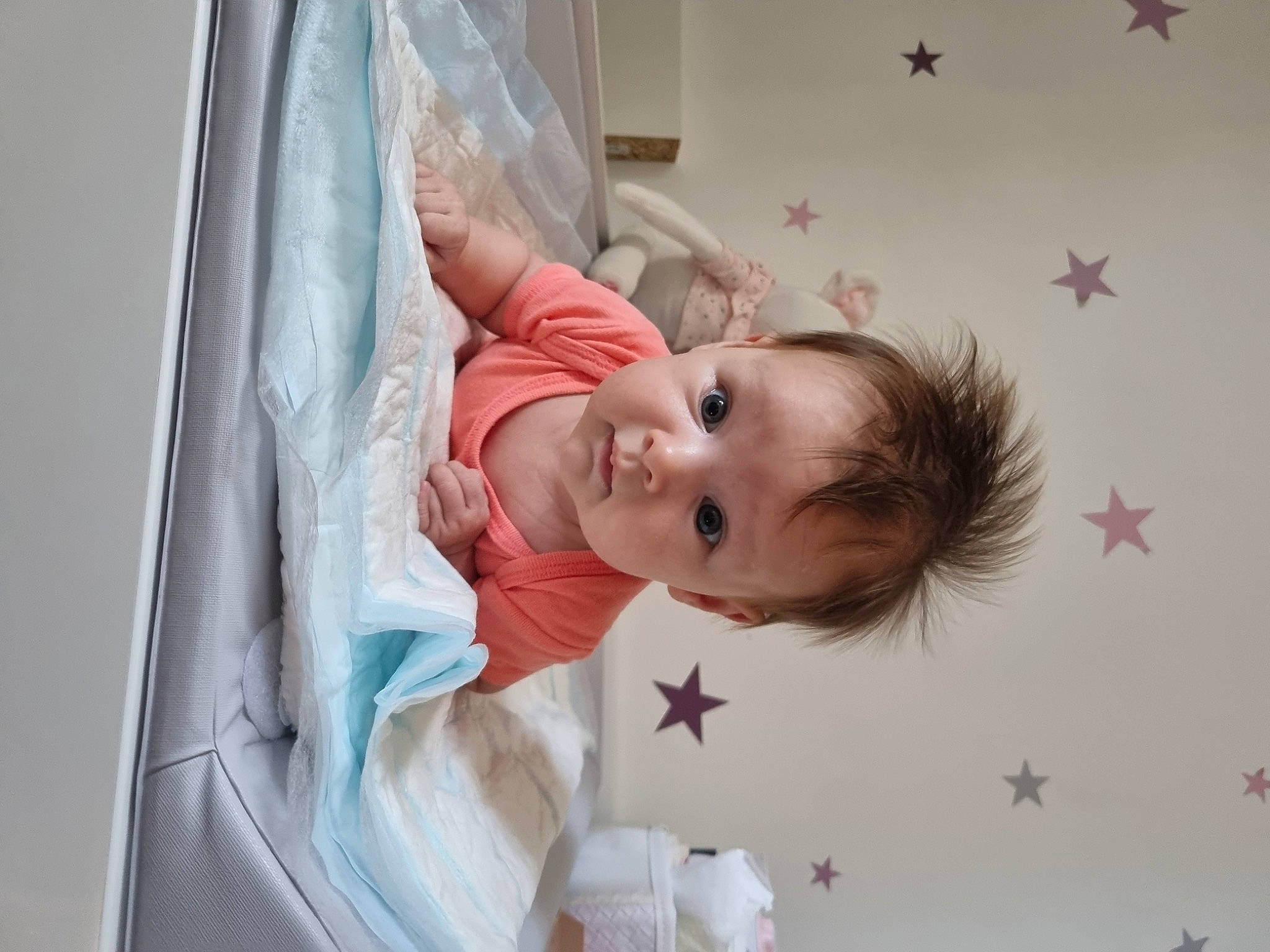 Amelya participe au concours pour gagner de l'argent avec cette photo : baby, baby_toddler_clothing, blond, cheek, child, comfort, dress, eyebrow, eyelash, fashion_accessory, flash_photography, happy, iris, linens, lip, person, pink, product, skin, toddler