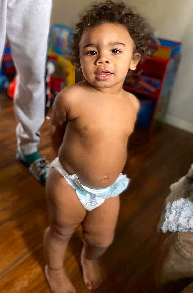 Amir is registered to the contest to win money with this photo: abdomen, baby, cheek, chest, eye, face, hair, happy, head, human_leg, knee, navel, person, stomach, swimwear, thigh, thumb, toddler, trunk, undergarment