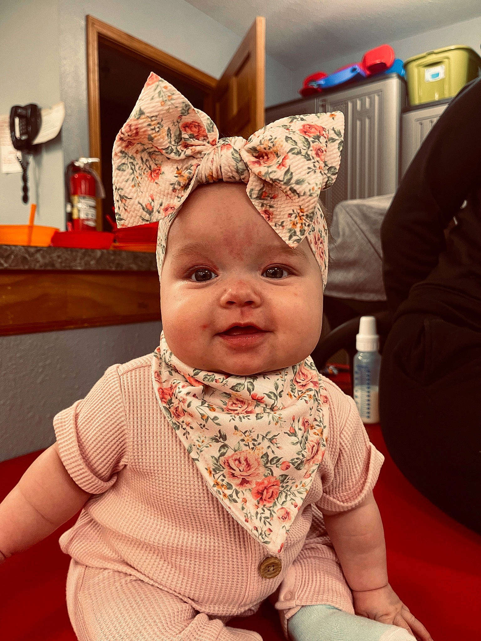 Paislee is registered to the contest to win money with this photo: baby, baby_toddler_clothing, cap, child, christmas, christmas_eve, costume_hat, event, eye, fashion_accessory, fun, happy, headwear, holiday, person, pink, room, sleeve, smile, textile