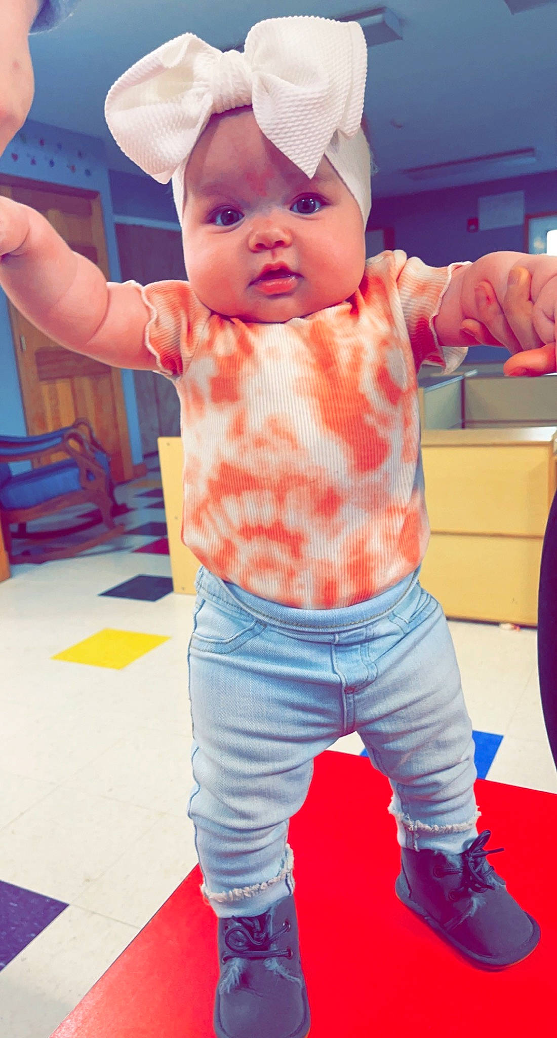 Paislee joined the competition — help win amazing prizes! arm, baby, baby_toddler_clothing, cheek, finger, gesture, hairstyle, hand, headwear, joint, mouth, orange, person, photograph, pink, product, skin, sleeve, standing, toddler