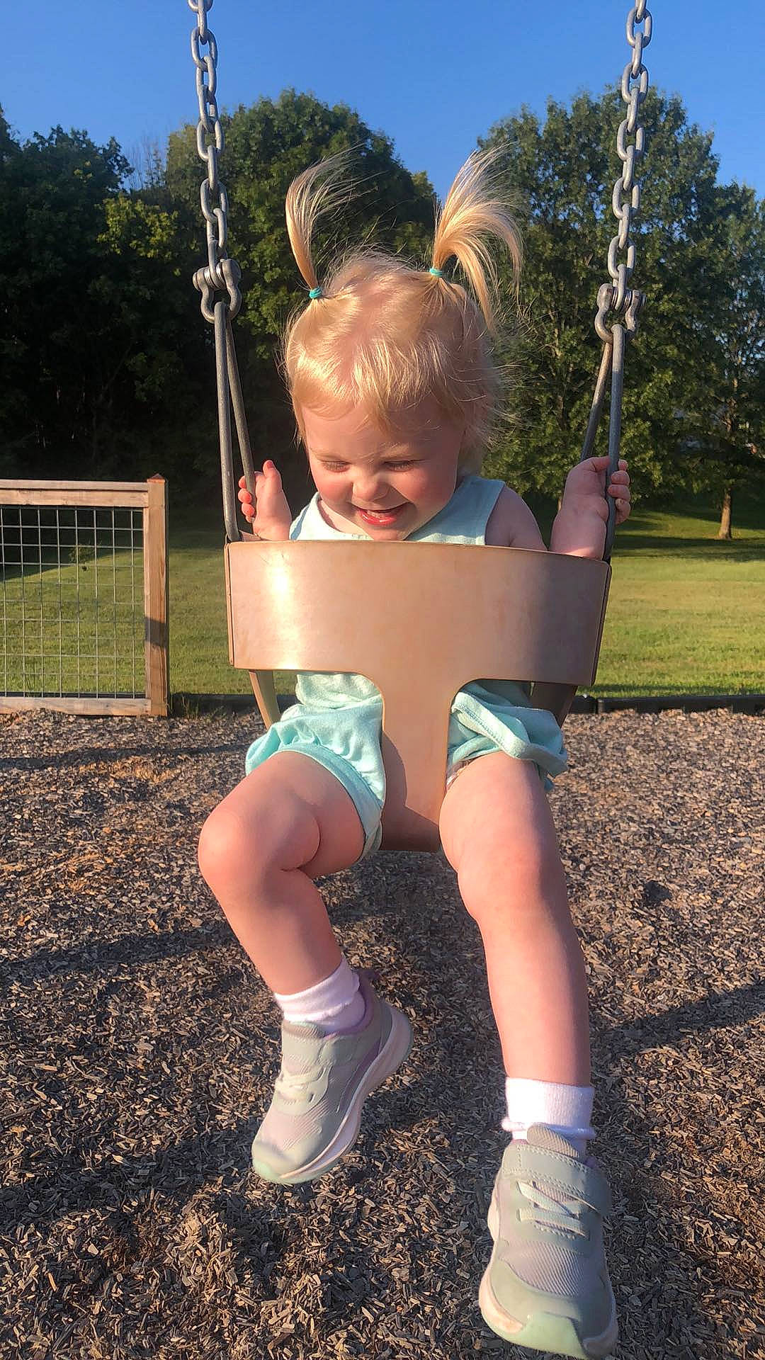 Carmen joined the competition — help win amazing prizes! city, electric_blue, fun, grass, happy, human_leg, joy, knee, leisure, outdoor_play_equipment, people_in_nature, person, playground, recreation, shade, shorts, sky, swing, t_shirt, thigh