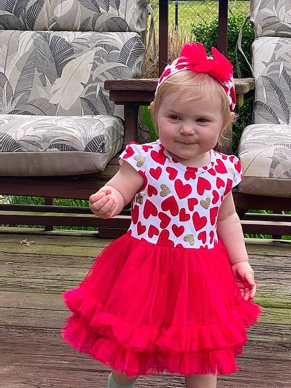 Carmen is registered to the contest to win money with this photo: baby, baby_toddler_clothing, beauty, day_dress, dress, face, facial_expression, fun, happy, headgear, joy, magenta, one_piece_garment, person, pink, purple, skin, sleeve, smile, textile