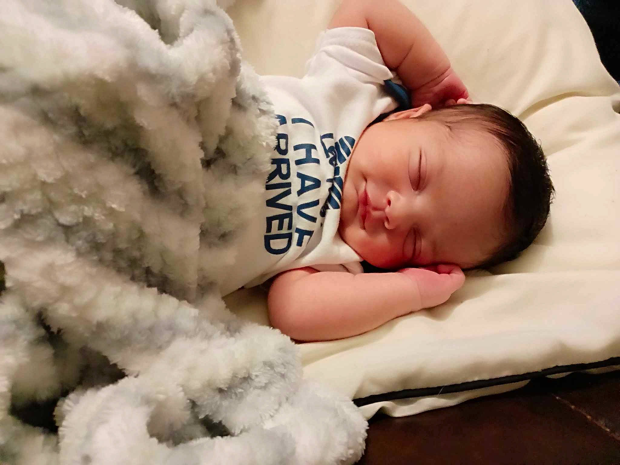 Corvin is registered to the contest to win money with this photo: baby, baby_sleeping, baby_toddler_clothing, bedtime, child, comfort, flash_photography, font, fur, happy, headgear, linens, mammal, nap, pattern, person, portrait_photography, sitting, sleep, toddler