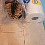 Cleopatra joined the competition — help win amazing prizes! cat, toilet_paper, plastic_package, tile_floor, curious, indoor, pet, animal, striped_cat, hiding, peeking, floor, towel, home, cozy, playful, feline, brown, black, white