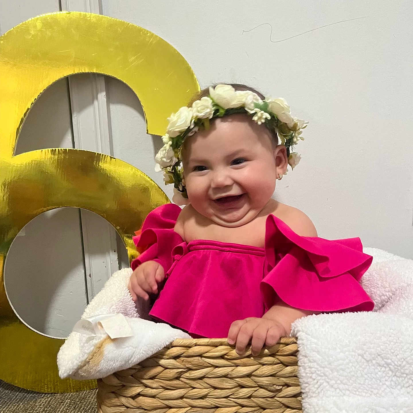 Adry Sophia joined the competition — help win amazing prizes! baby, child, smile, flower_crown, pink_clothing, basket, blanket, indoor, happy, cute, portrait, celebration, number_6, floor, woven_basket, toddler, person, head, face, joy