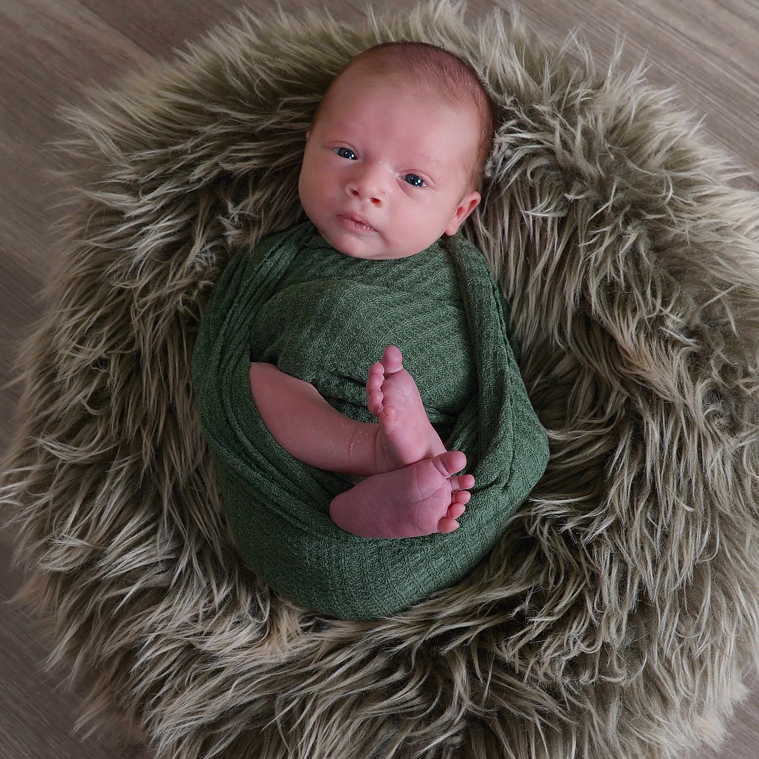 Caspian joined the competition — help win amazing prizes! baby, blanket, child, cozy, cute, expression, face, feet, floor, fur_rug, head, indoor, infant, looking_at_camera, newborn, portrait, skin, small, soft_texture, wrapped