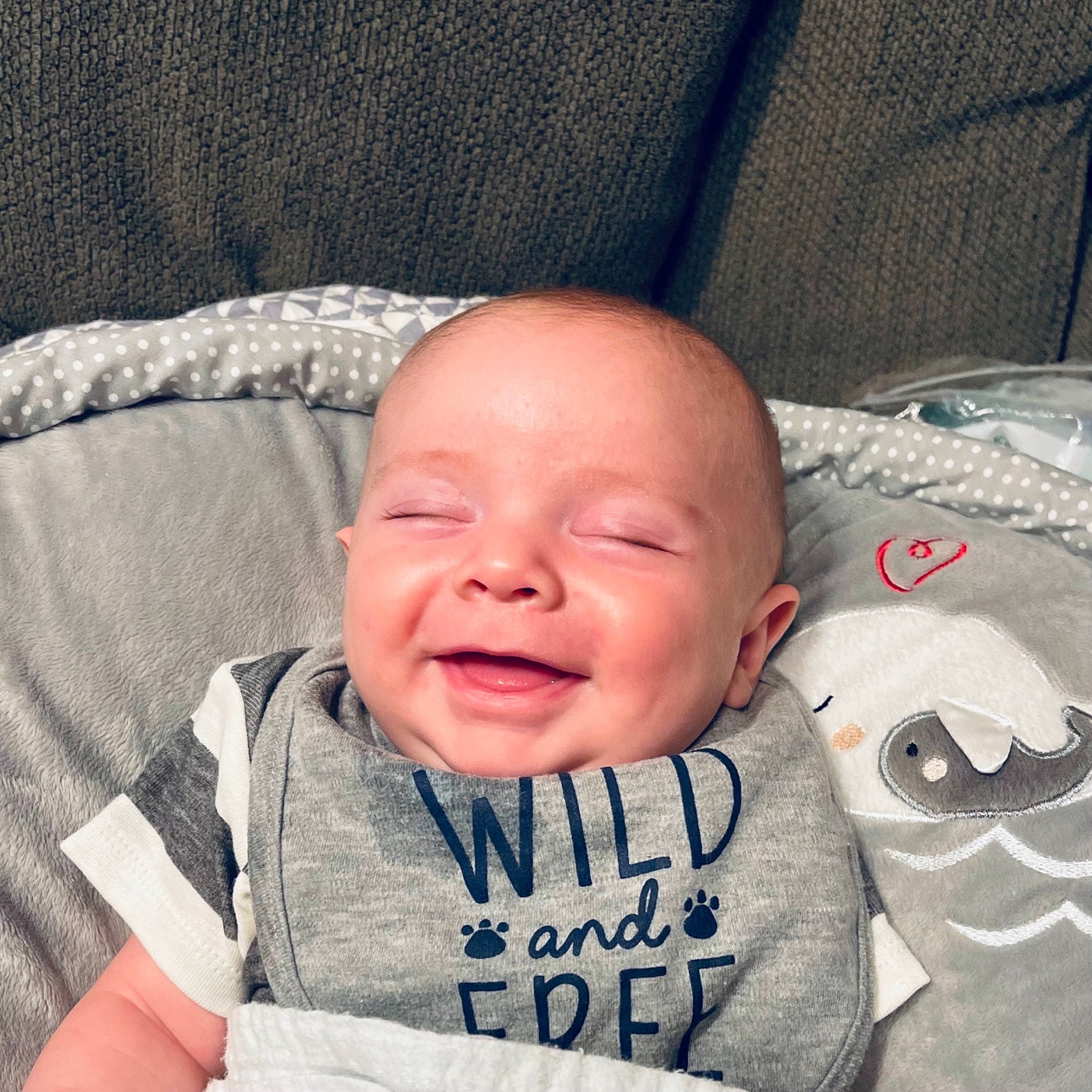 Gavyn is registered to the contest to win money with this photo: baby, baby_sleeping, baby_toddler_clothing, cheek, chin, comfort, cool, face, facial_expression, finger, happy, head, lip, mouth, nose, person, skin, sleeve, smile, textile
