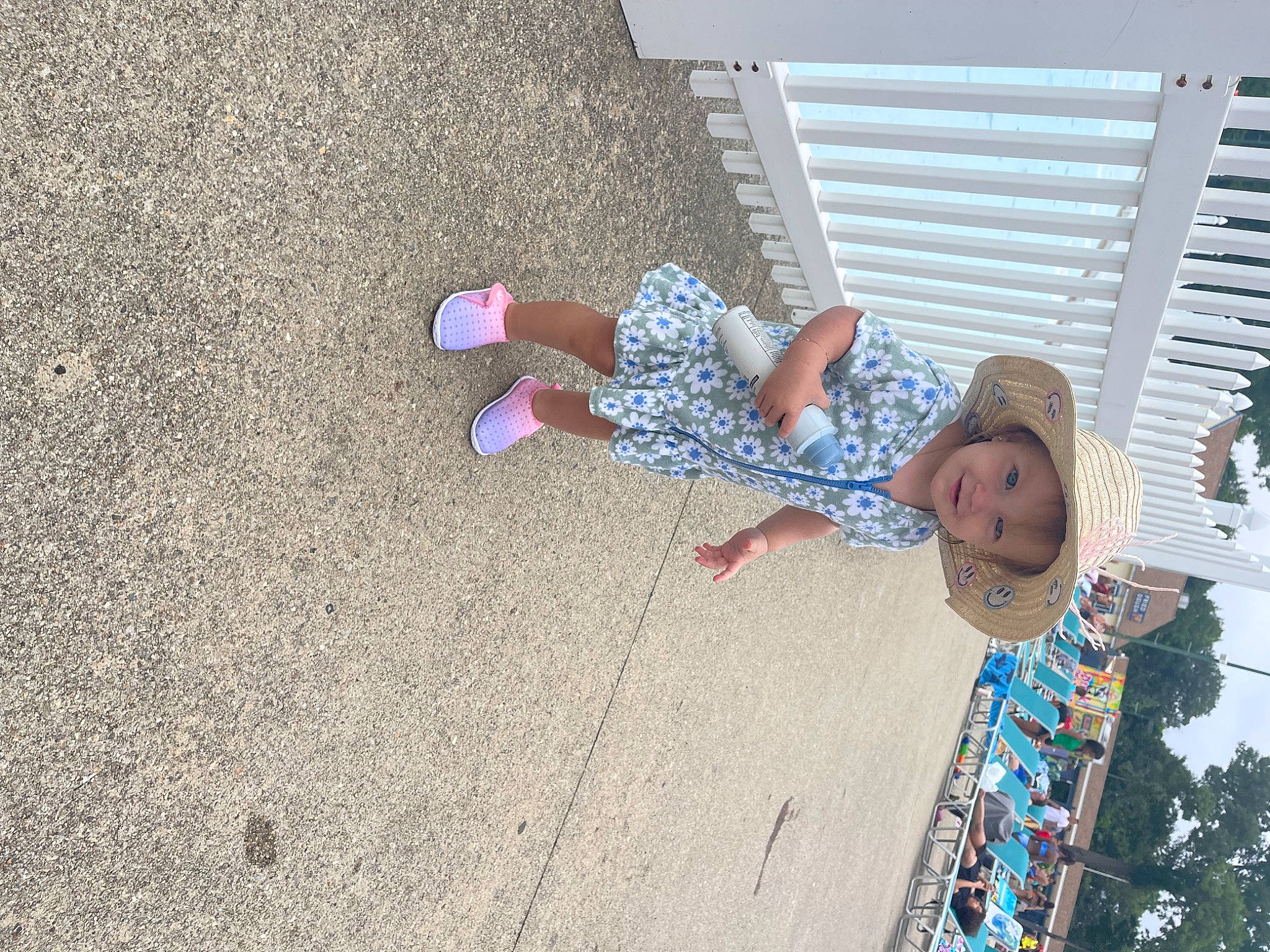 Alice is registered to the contest to win money with this photo: asphalt, baby, child, city, concrete, foot, fun, human_leg, joy, leisure, person, play, road_surface, shadow, sidewalk, soil, toddler, vacation