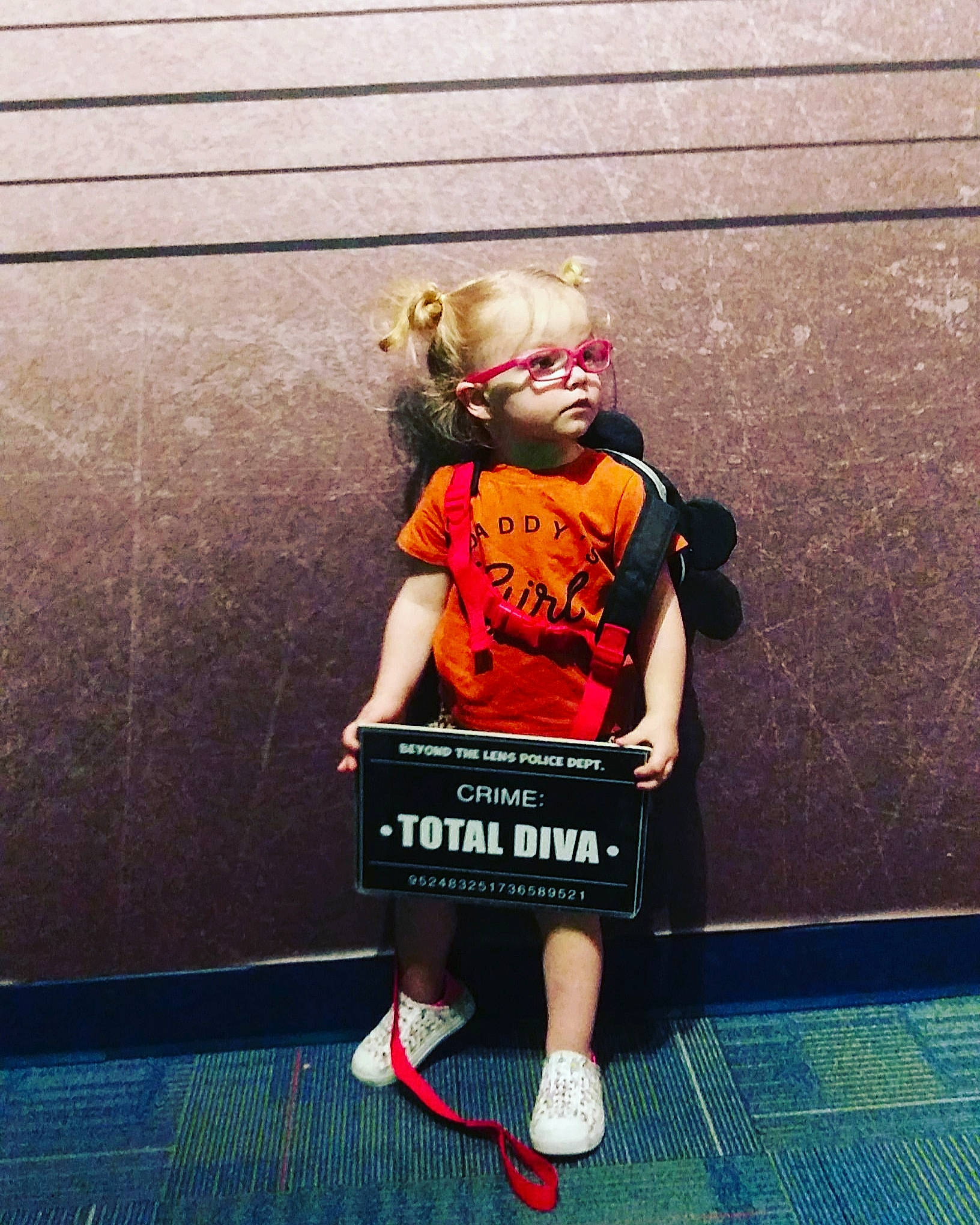 Paislea is registered to the contest to win money with this photo: child, eyewear, flooring, font, fun, happy, jersey, knee, leisure, magenta, person, player, room, shorts, sitting, sports, sports_uniform, sportswear, t_shirt, thigh