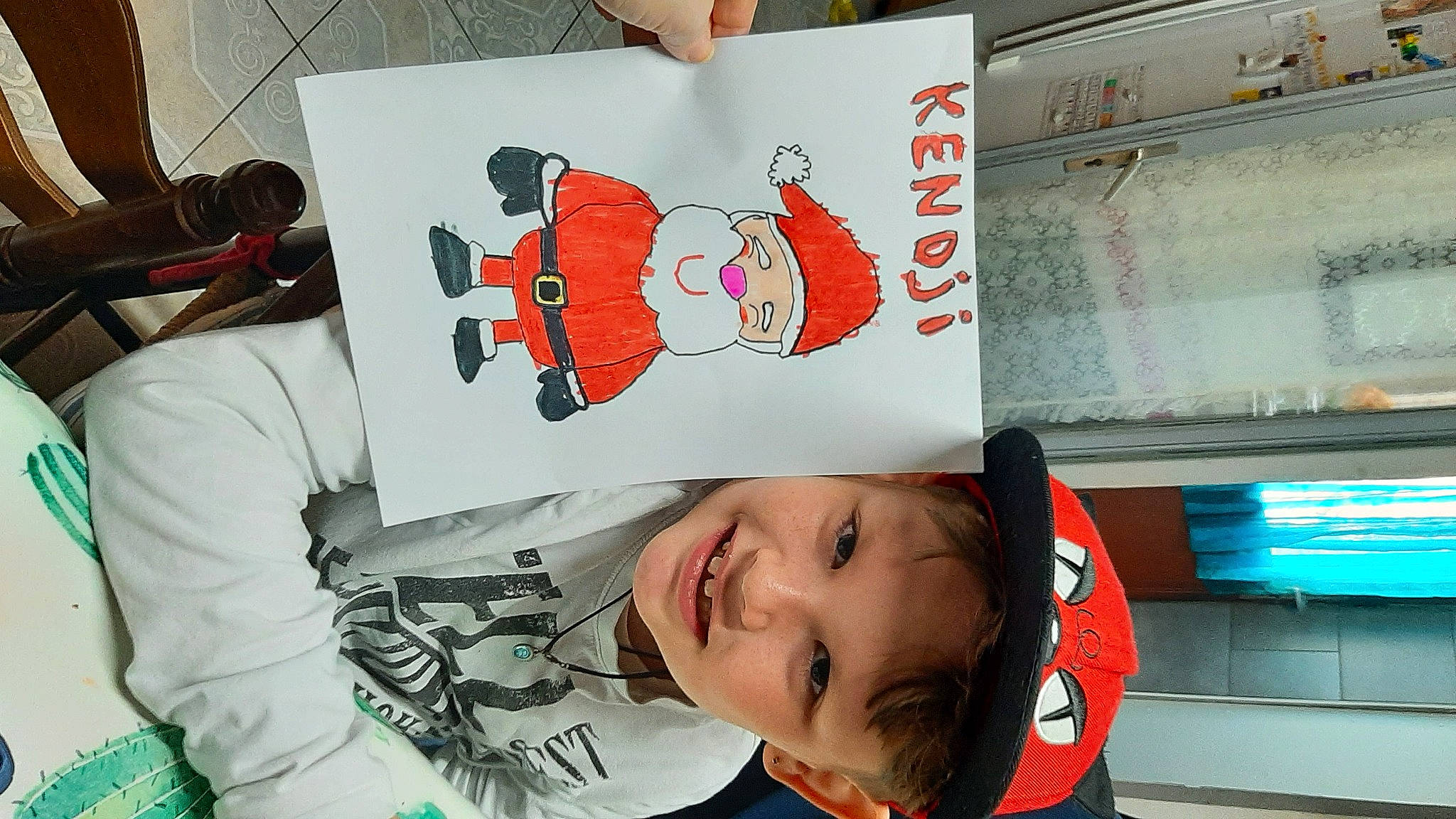 Kendji participe au concours pour gagner de l'argent avec cette photo : art, baby, baby_toddler_clothing, carmine, child, font, happy, ink, joy, paper, person, product, red, room, sleeve, smile, t_shirt, toddler, visual_arts, white