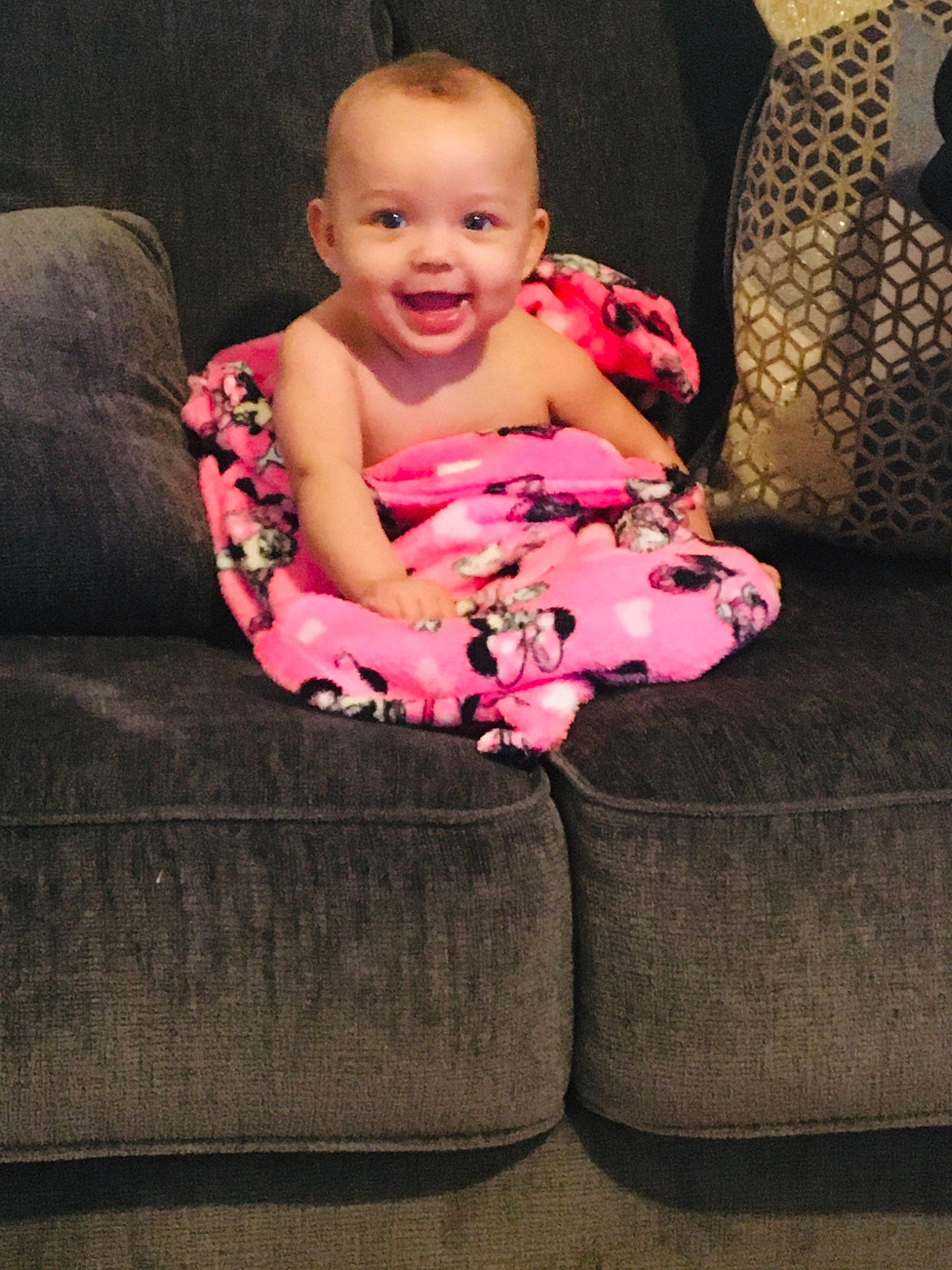 Jaylianna joined the competition — help win amazing prizes! baby, baby_toddler_clothing, comfort, couch, dress, eye, face, flooring, human_body, human_leg, joy, leg, magenta, pattern, person, pink, sitting, sleeve, smile, thigh