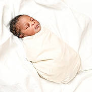 Ugochukwu joined the competition — help win amazing prizes! newborn, baby, sleeping, swaddled, blanket, infant, soft, white, peaceful, resting, cute, portrait, child, cozy, wrapped, tiny, head, face, peace, comfort