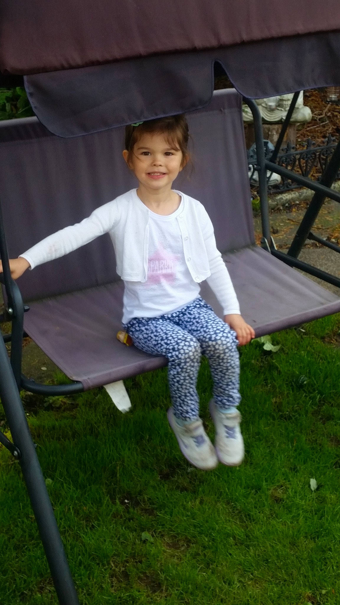 Kaci is registered to the contest to win money with this photo: backyard, chair, child, furniture, joy, leisure, outdoor_furniture, person, sitting