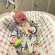 Michael joined the competition — help win amazing prizes! baby, infant, pajamas, mickey_mouse, toy, baby_seat, patterned_fabric, smiling, happy, indoor, cozy, child, clothing, face, hand, footwear, furniture, room, door, comfort