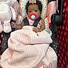 Amara is registered to the contest to win money with this photo: baby, child, infant, shopping_cart, pacifier, blanket, plush_toy, elephant, hair_bow, strawberry, pink, heart_pattern, seated, harness, portrait, indoors, shopping, cute, looking_at_camera, baby_carrier
