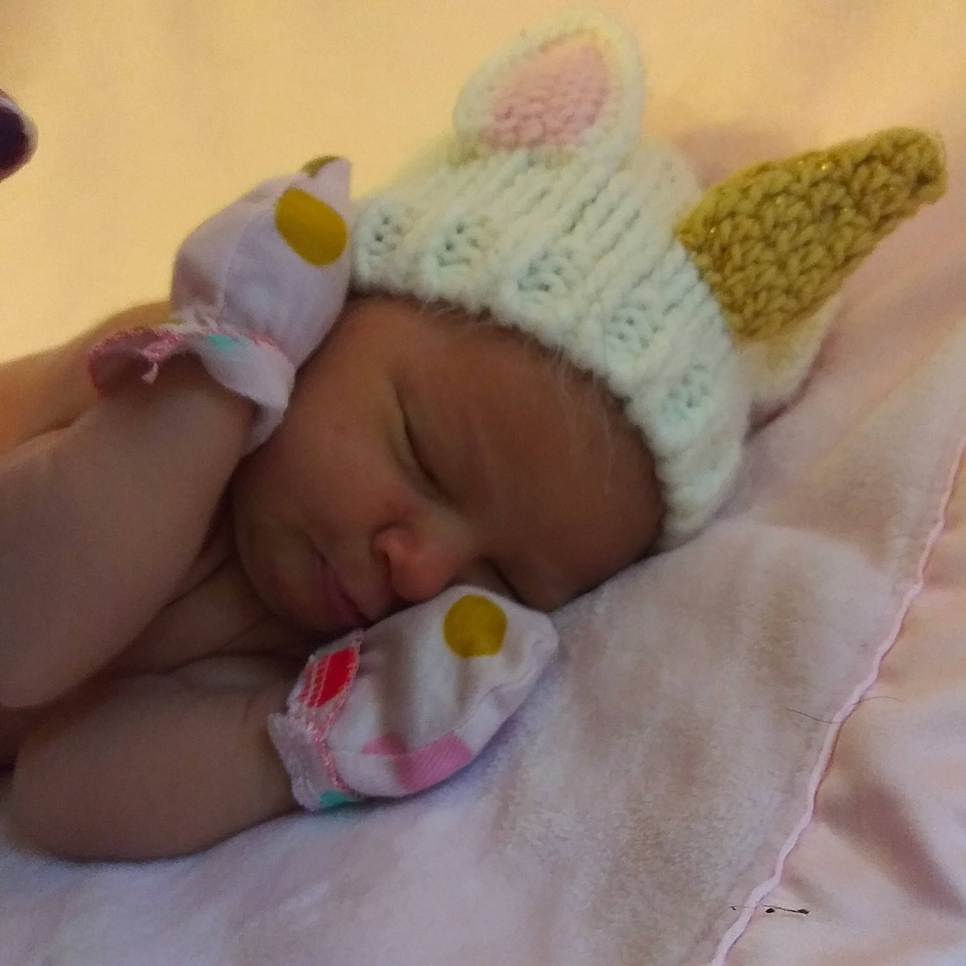 Lilith is registered to the contest to win money with this photo: baby, baby_products, baby_sleeping, beanie, bedtime, birth, bonnet, child, ear, fashion_accessory, hair_accessory, hand, headgear, headwear, nap, person, pink, product, skin, sleep