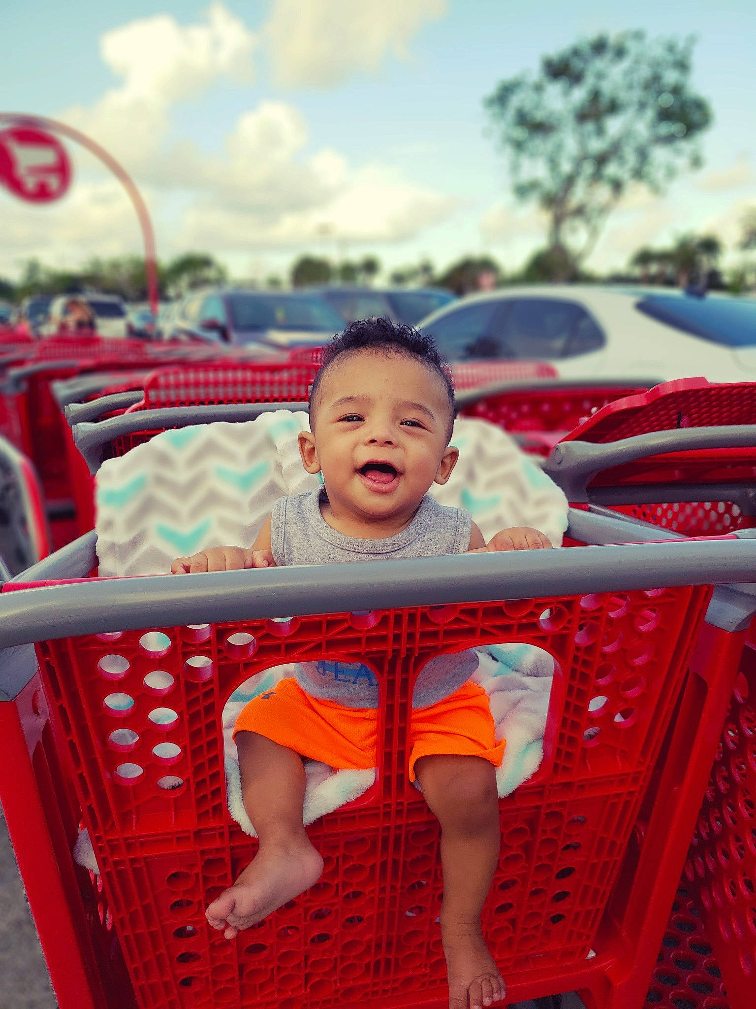 Santiago joined the competition — help win amazing prizes! boy, child, day, fun, happiness, infant, leisure, person, play, product, recreation, red, sitting, smile, summer, toddler, vacation