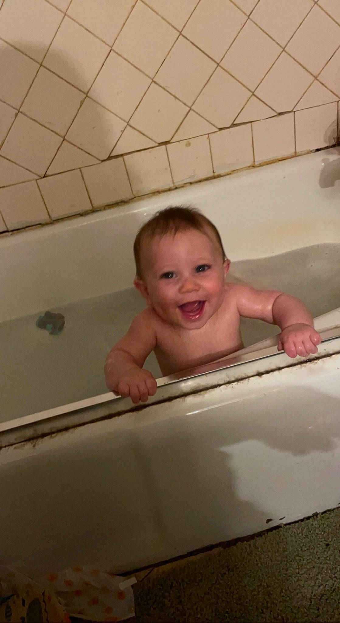 Raiden is registered to the contest to win money with this photo: baby, bathing, bathroom, bathtub, chest, child, chin, comfort, composite_material, eye, eyebrow, flooring, fluid, fun, happy, joy, leisure, person, plumbing, smile