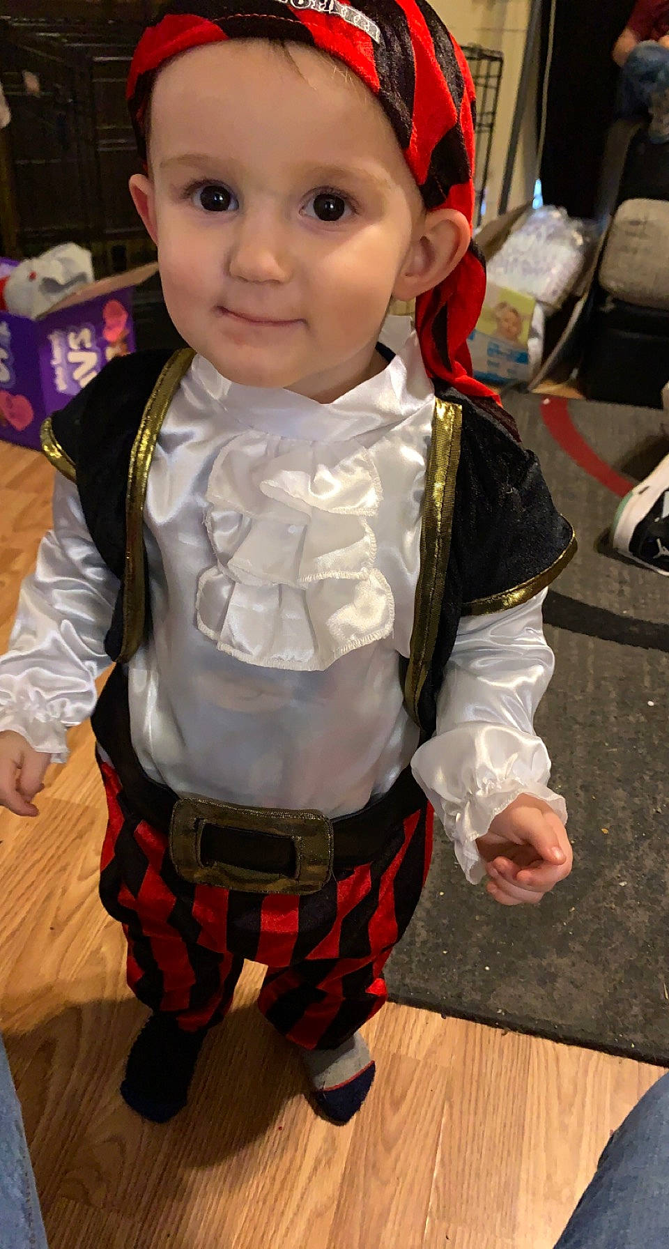 Noah is registered to the contest to win money with this photo: baby, belt, cheek, child, costume, event, fashion_accessory, fictional_character, fun, hat, headwear, pattern, person, plaid, sitting, skin, sleeve, tartan, toddler, uniform