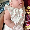 Madison Maravilla is registered to the contest to win money with this photo: baby, infant, sleeping, portrait, headband, bow, white_clothing, onesie, mitten, bed, blanket, indoor, closeup, face, peaceful, resting, patterned_fabric, parent, arm, photography