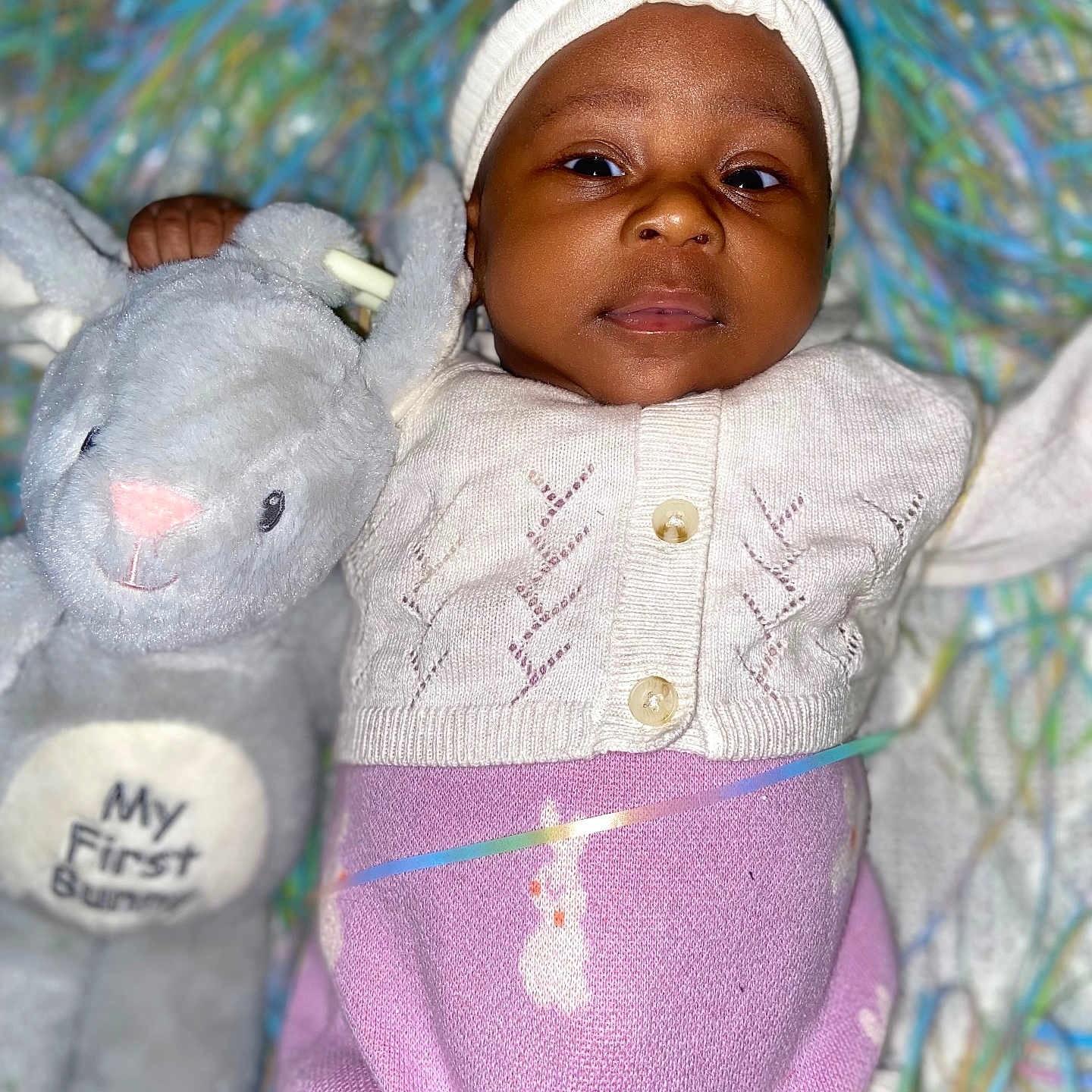 Zyonna joined the competition — help win amazing prizes! baby, blanket, bonnet, cap, clothing, coat, face, furniture, happy, hat, head, jacket, knitwear, newborn, person, photography, portrait, smile, teddybear, toy