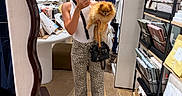 Moscou participe au concours pour gagner de l'argent avec cette photo : dog, fashion, fluffy, furniture, home_goods, indoors, leopard_print, mirror_selfie, person, pet, pomeranian, portrait, shelves, shopping, small_dog, smartphone, store, textiles, woman, wooden_floor