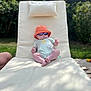 Freya joined the competition — help win amazing prizes! baby, child, outdoor, sunhat, sunglasses, lounge_chair, pillow, grass, sunlight, relaxing, summer, greenery, infant, casual, shade, garden, cute, small, one_person, daytime