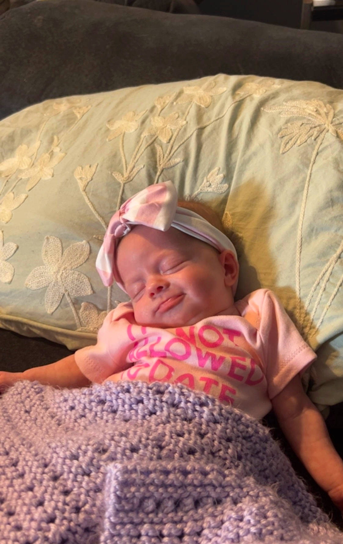 Aurora June joined the competition — help win amazing prizes! baby, baby_toddler_clothing, bedding, bedtime, cheek, child, comfort, couch, finger, fun, happy, linens, mouth, pattern, person, pink, sitting, skin, smile, textile